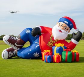 C1-515 Hip-hop style inflatable Santa Claus lying next to gifts